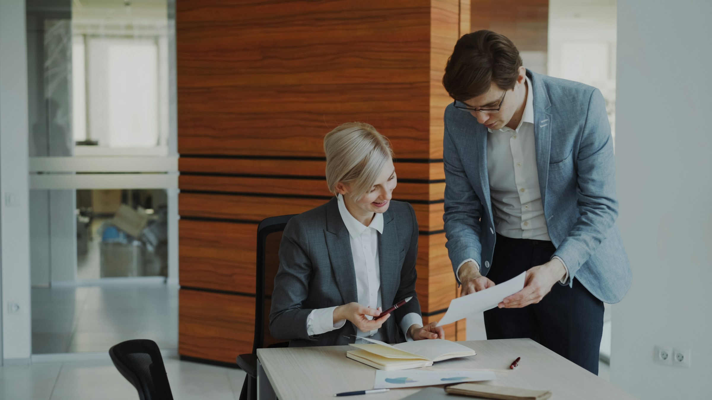Business professionals reviewing records together in an office